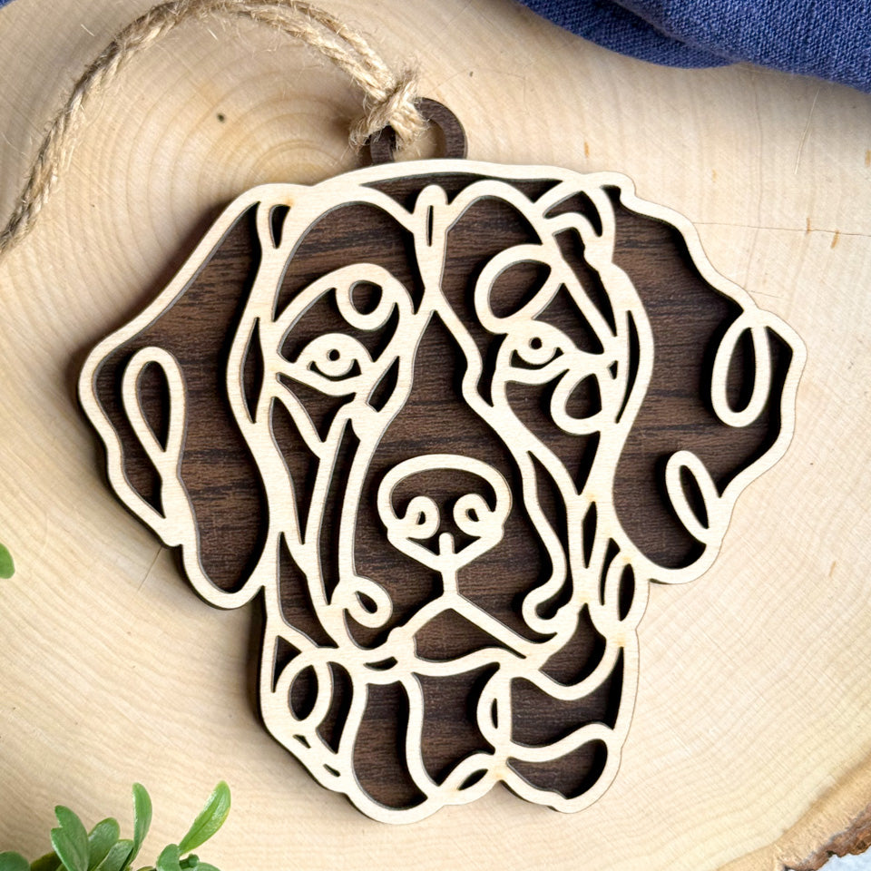 Mountain Cur line art dog ornament laser cut from natural wood.