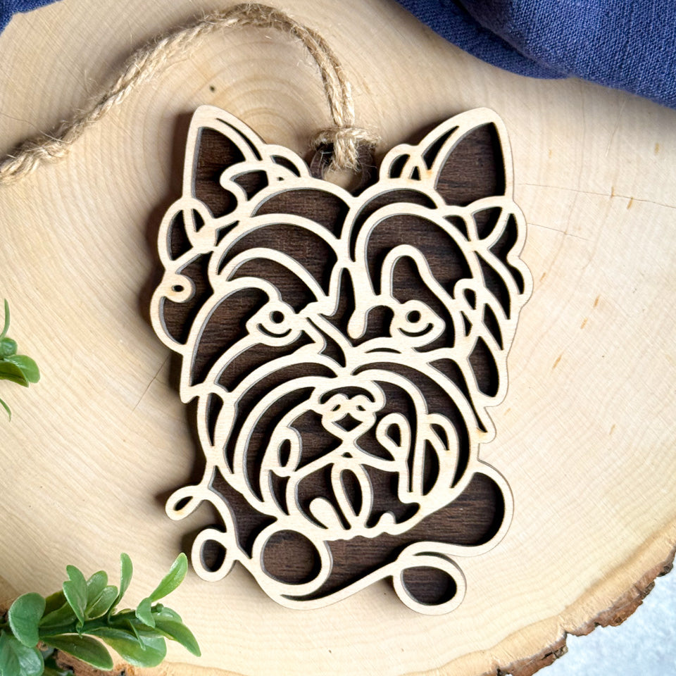 Norfolk Terrier line art dog ornament laser cut from natural wood.
