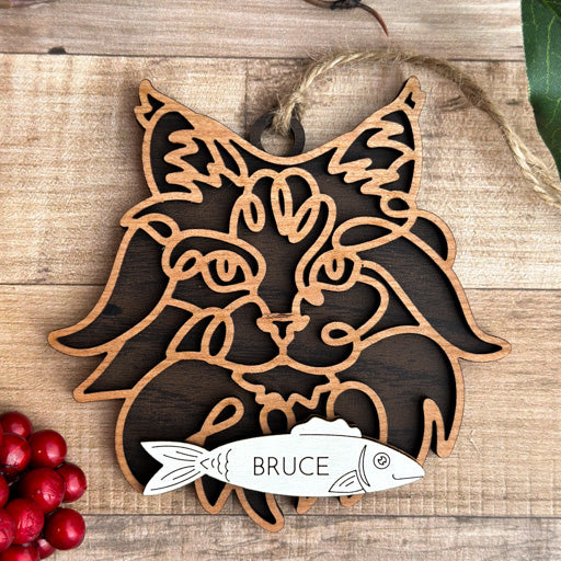 Norwegian Forest Cat line art cat ornament laser cut from natural wood, minimalist feline silhouette design