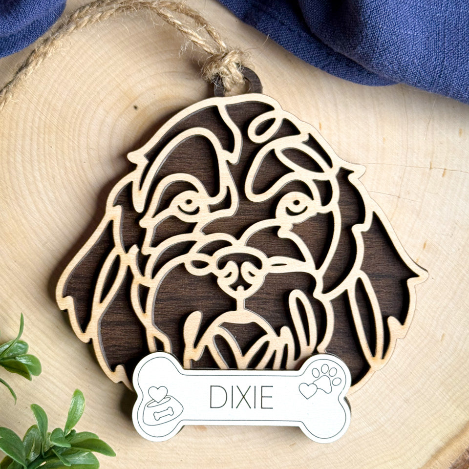 Petit Basset Grifon Vendeen line art dog ornament laser cut from natural wood.
