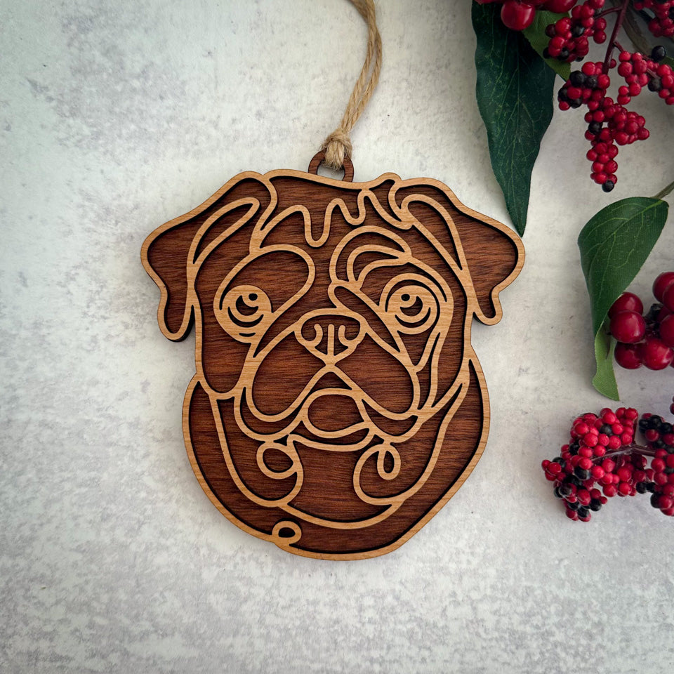 Pug line art dog ornament laser cut from natural wood.