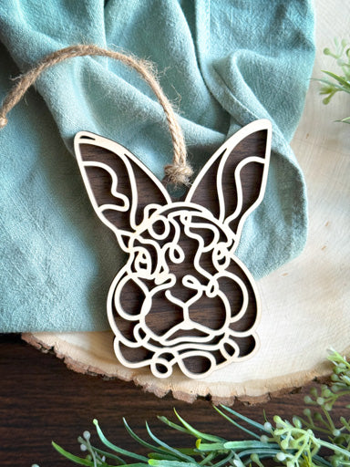rabbit line art ornament with tall ears laser cut from natural wood in continuous line style