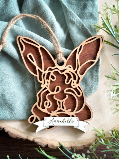 rex rabbit line art ornament laser cut from natural wood in continuous line style