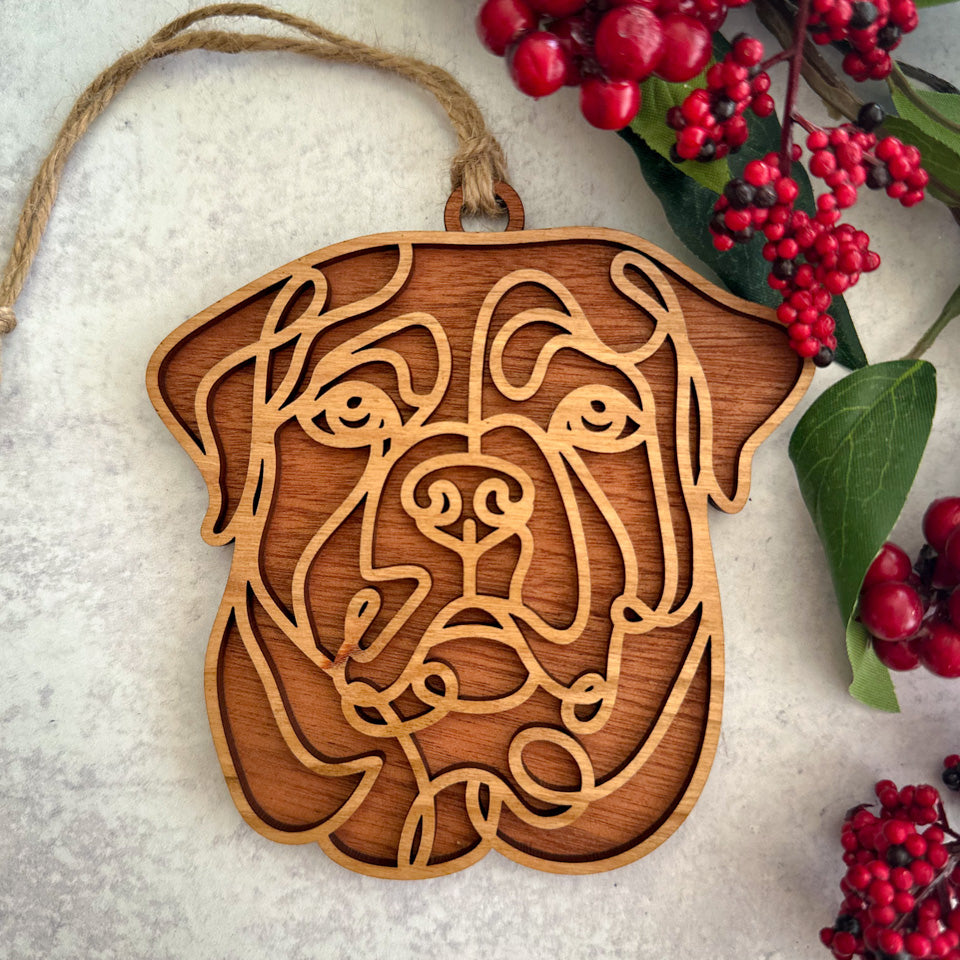 Rottweiler line art dog ornament laser cut from natural wood.