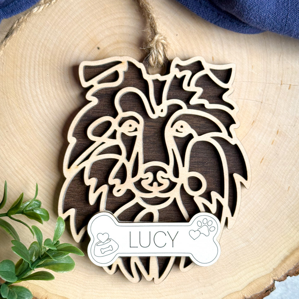 Rough Collie Tipped line art dog ornament laser cut from natural wood.