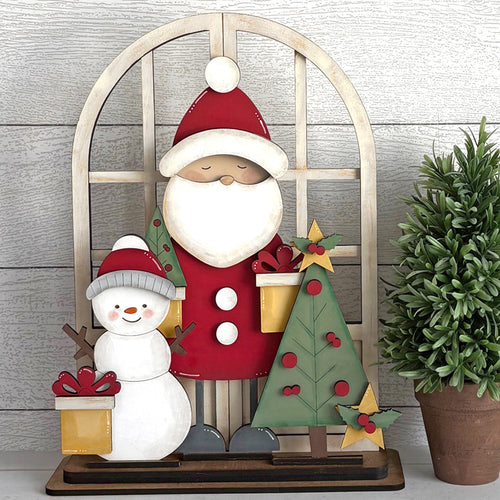 Santa and snowman with small tree