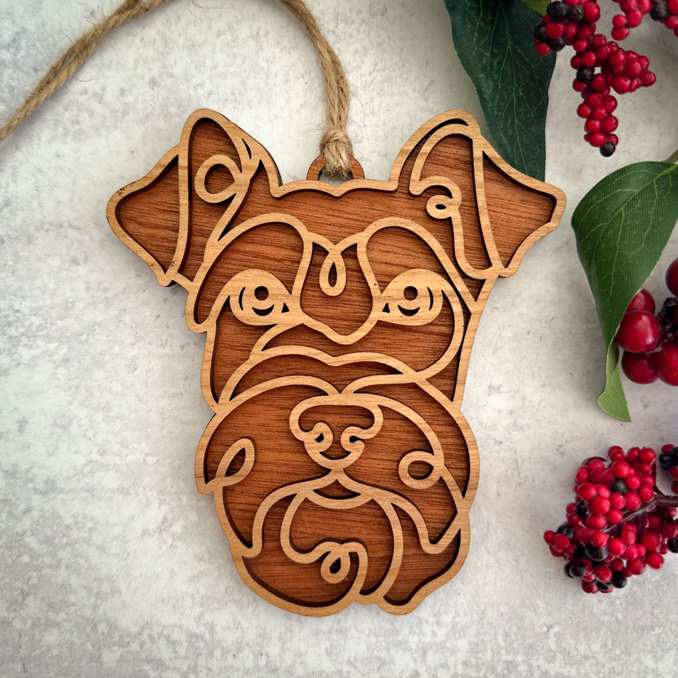 Schnauzer line art dog ornament laser cut from natural wood.