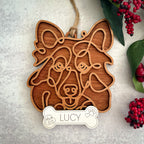 Sheltie line art dog ornament laser cut from natural wood.