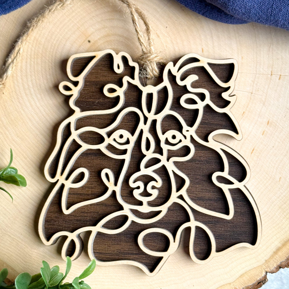 Sheltie Tipped Ears line art dog ornament laser cut from natural wood.