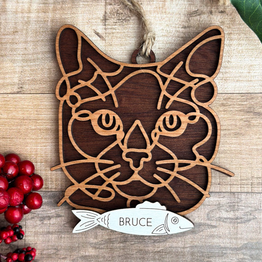 Siamese line art cat ornament laser cut from natural wood, minimalist feline silhouette design