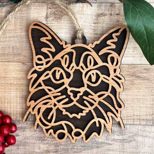Somali line art cat ornament laser cut from natural wood, minimalist feline silhouette design