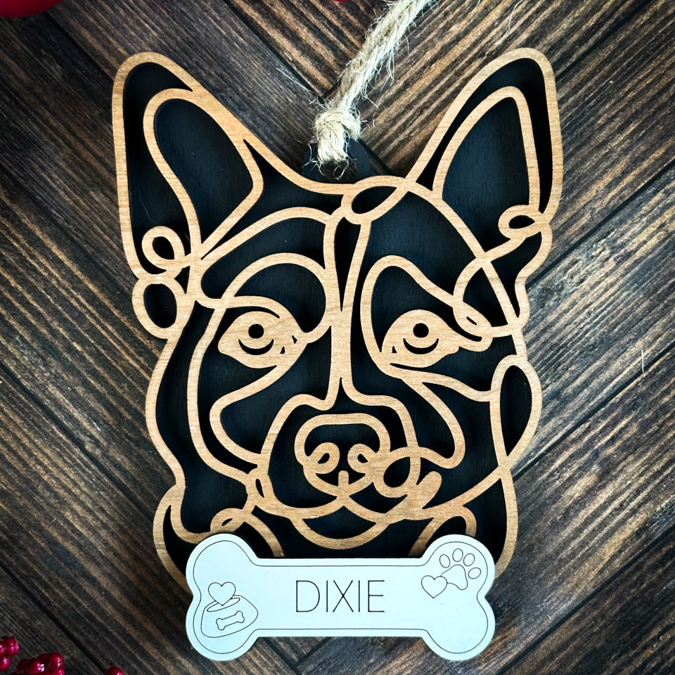 Swedish Vallhund line art dog ornament laser cut from natural wood.