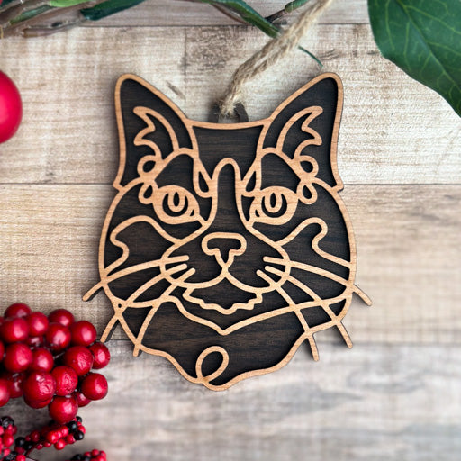 Tuxedo line art cat ornament laser cut from natural wood, minimalist feline silhouette design