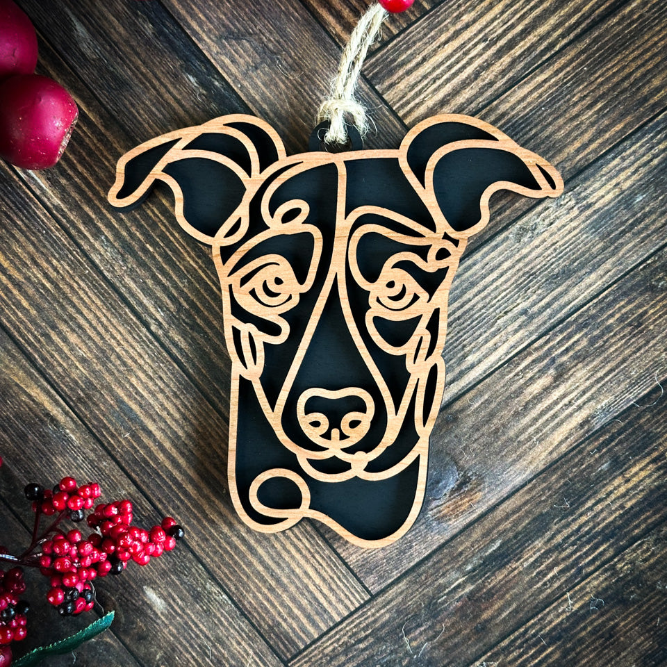 Whippet line art dog ornament laser cut from natural wood.