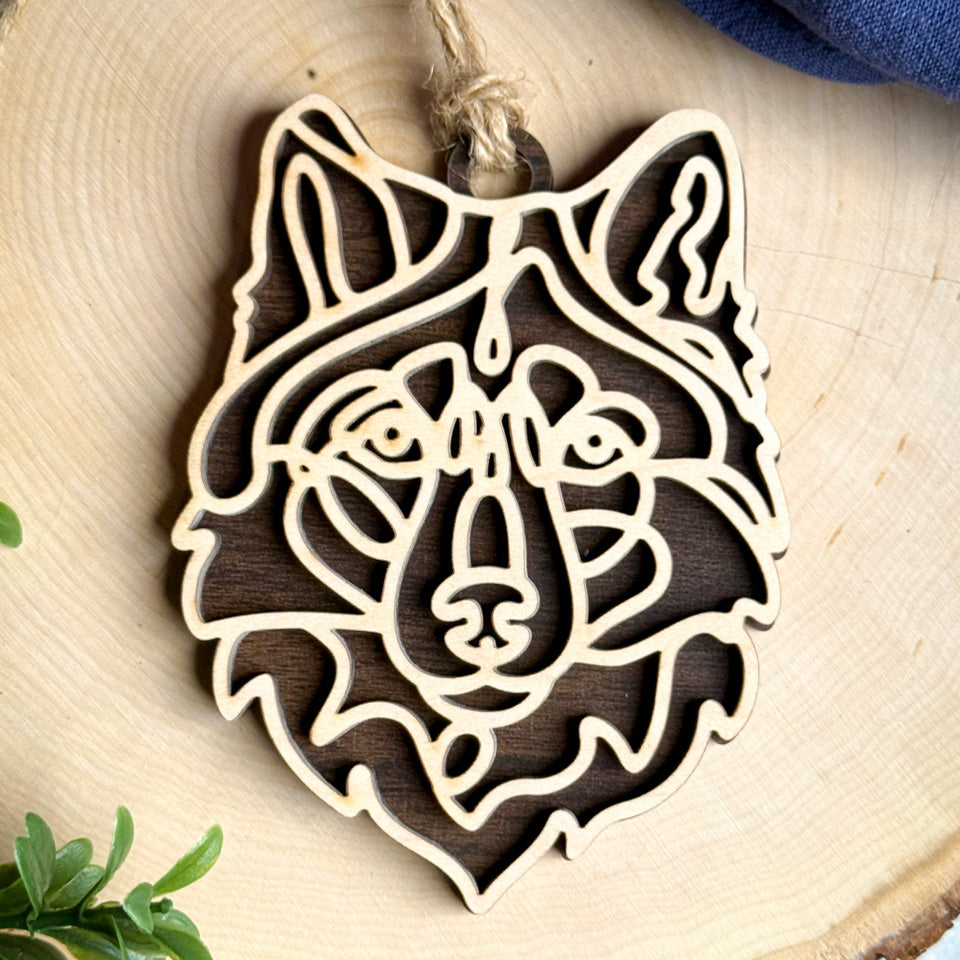 Wolf Dog line art dog ornament laser cut from natural wood.
