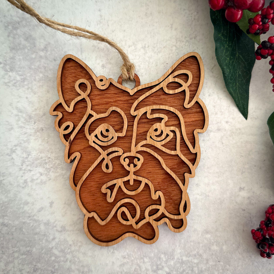 Yorkie line art dog ornament laser cut from natural wood.