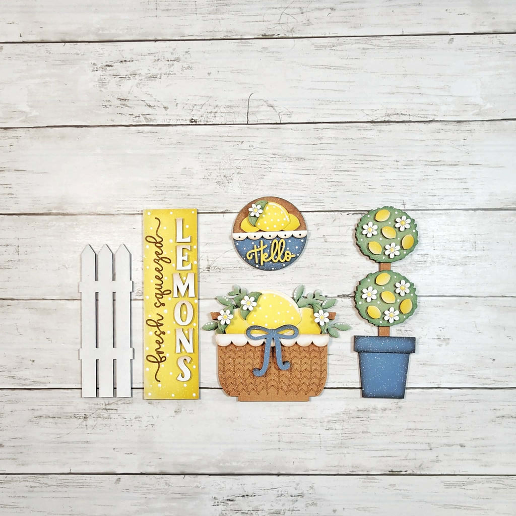 Decorative items with lemon theme on a wooden background